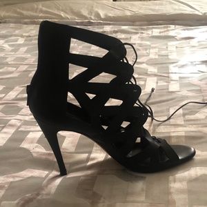 Black cross cross stilettos